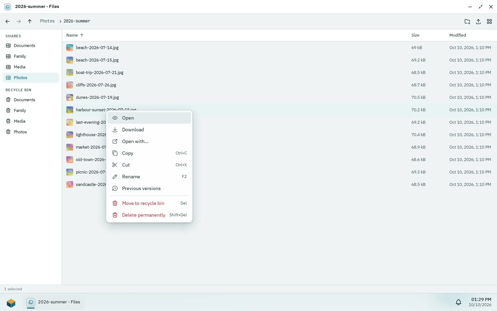 The Files app with the shared folders in the sidebar, a folder of twelve holiday photos in list view and the context menu of one photo open